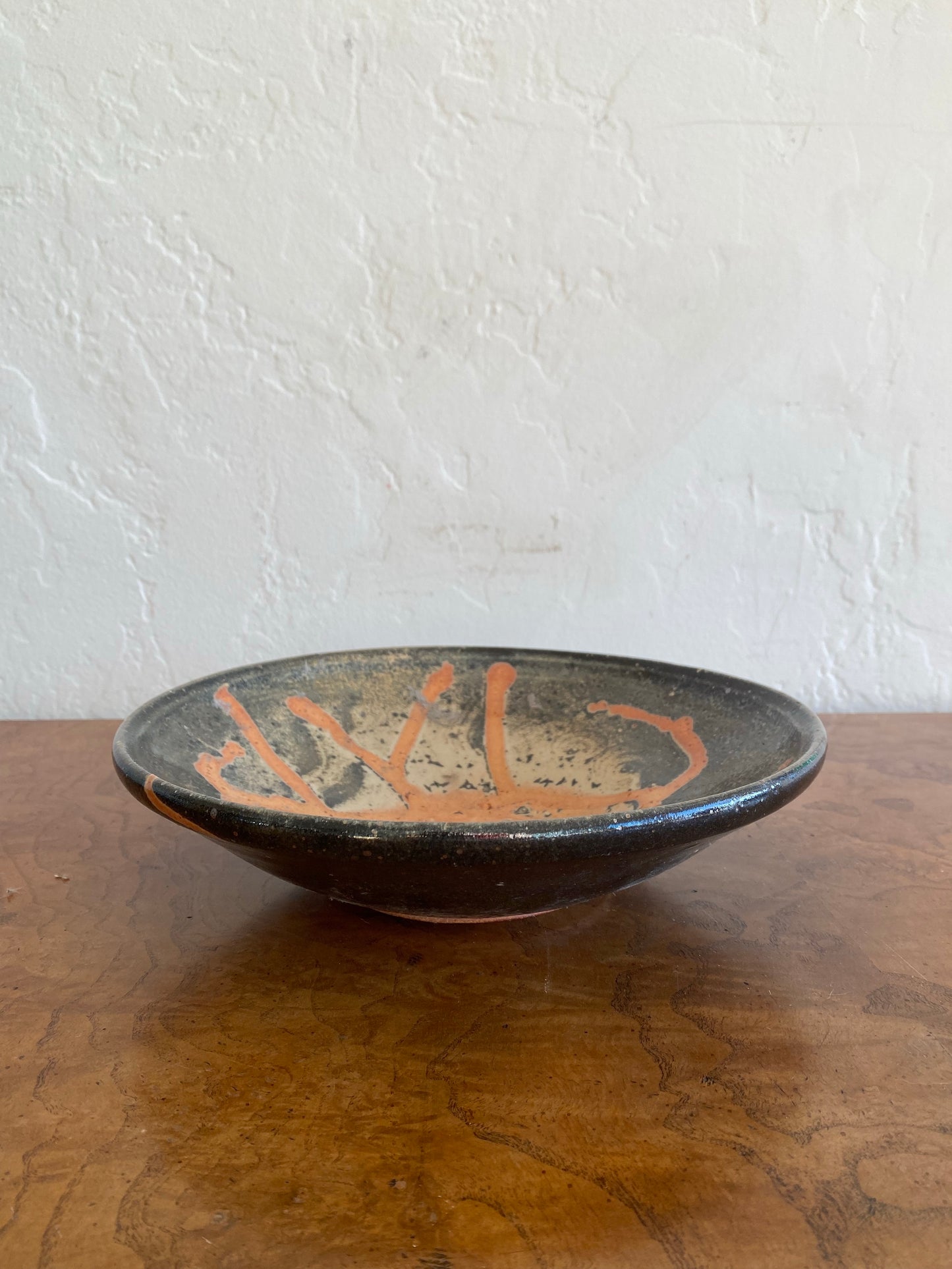 Orange and black studio pottery low bowl